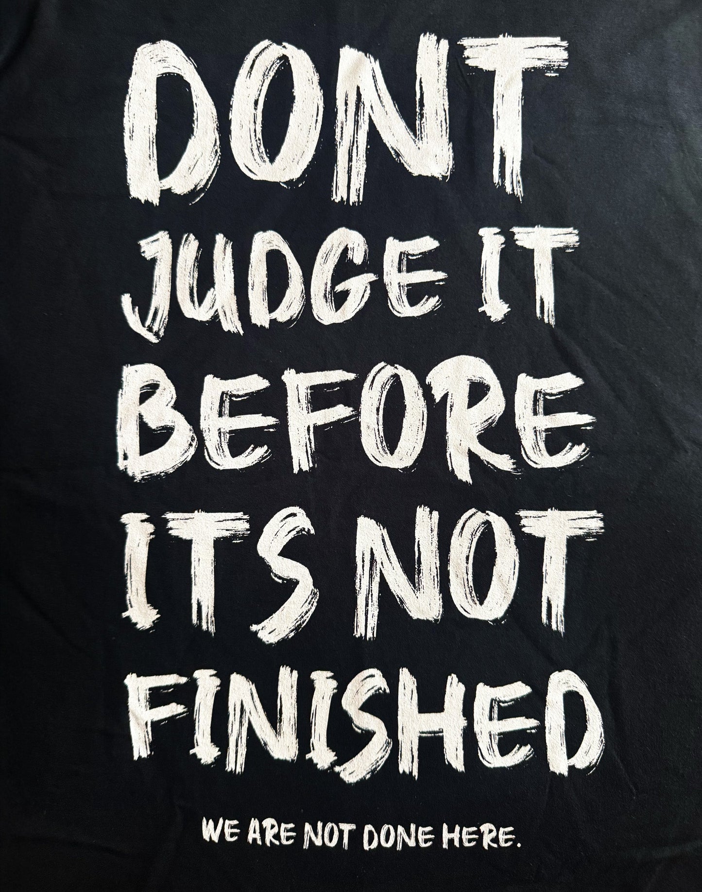 Black Unisex Premium Heavyweight Back-Design Tee "Before It's Not Finished" by Designer and Artist Lucas Gillon