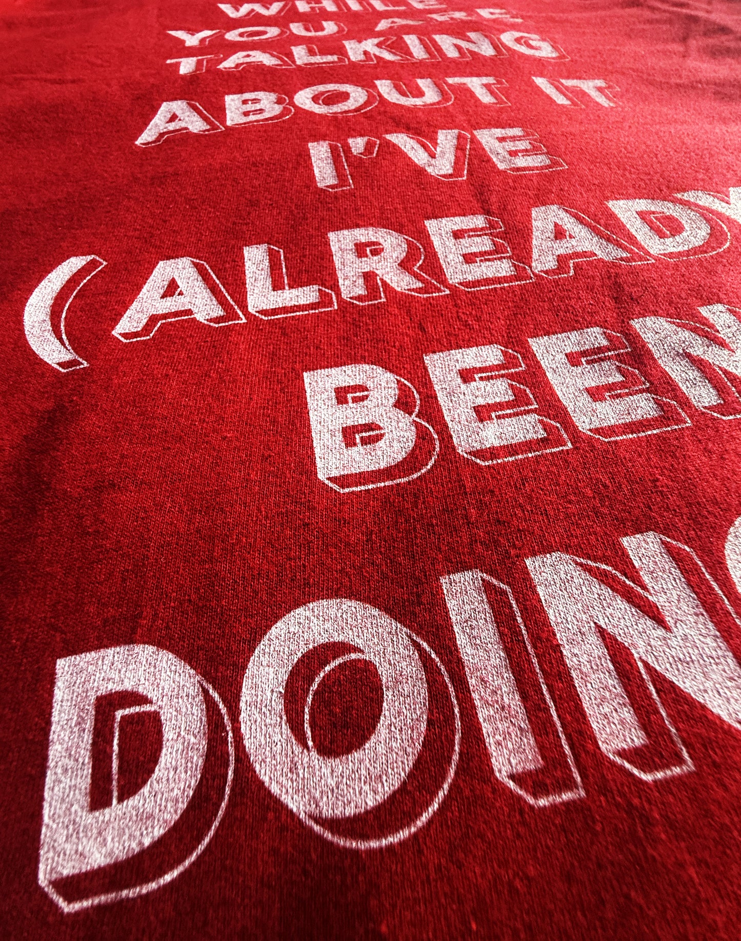 Red Unisex Heavy Premium Back-Design Tee "Already Doing It" by Designer and Artist Lucas Gillon